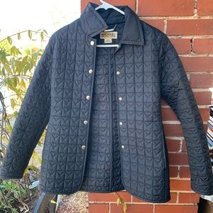 Black quilted jacket. Michael Kors.